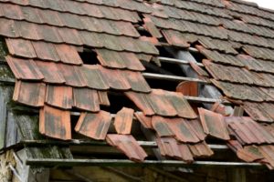18223219 – damaged roof of an old rural house